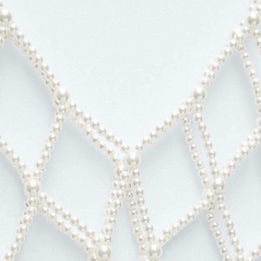 Top de perlas blancas