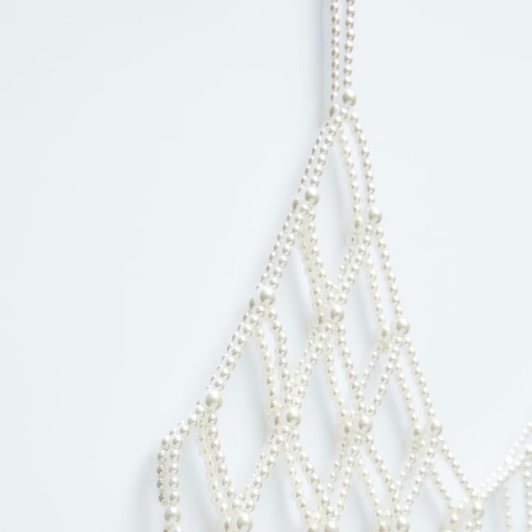 Top de perlas blancas