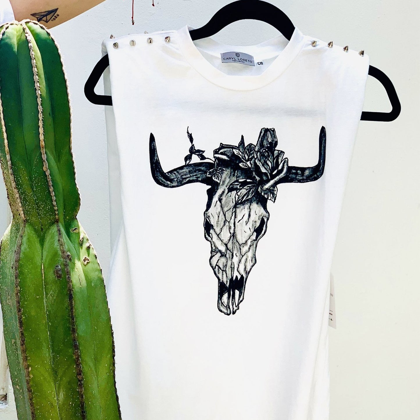 Toro shoulder pad blouse.