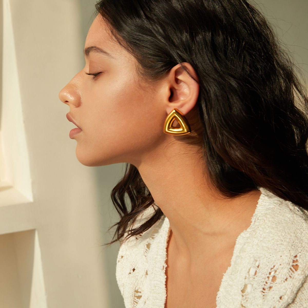 Golden triangle earrings.